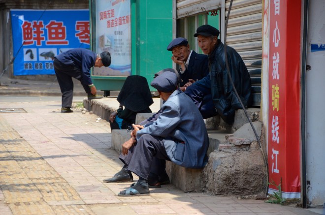 Locals relax in the heat of the day.