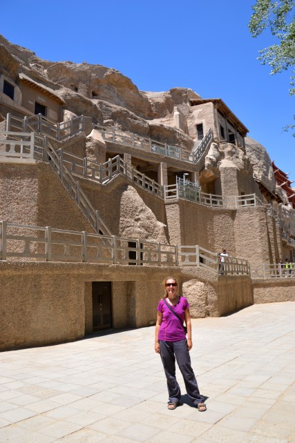 In front of the Mogao Grottoes.