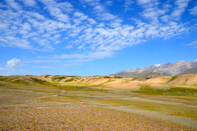 Rolling green hills surround us.