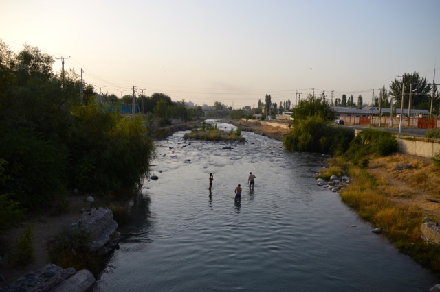 Locals swim in the river.