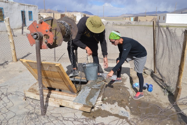 Collecting water from the local well.
