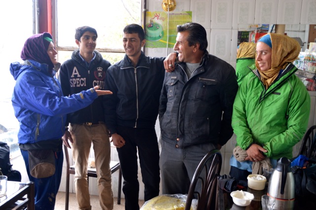 Chatting and warming up while waiting for a snow storm to pass.