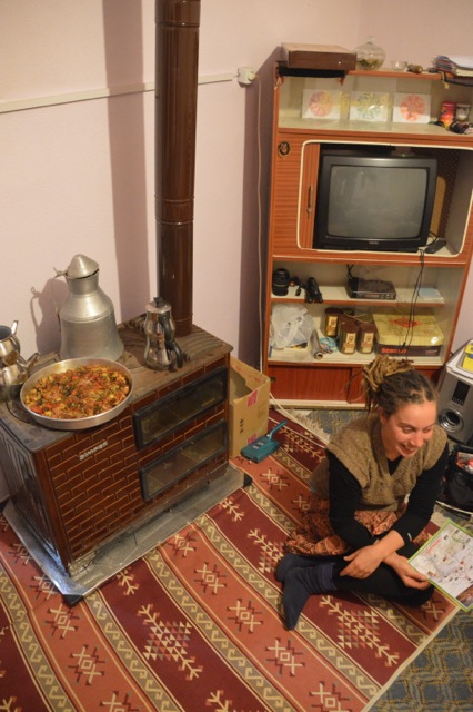Jude and our dinner heating by the pot belly stove at Aiden's house.