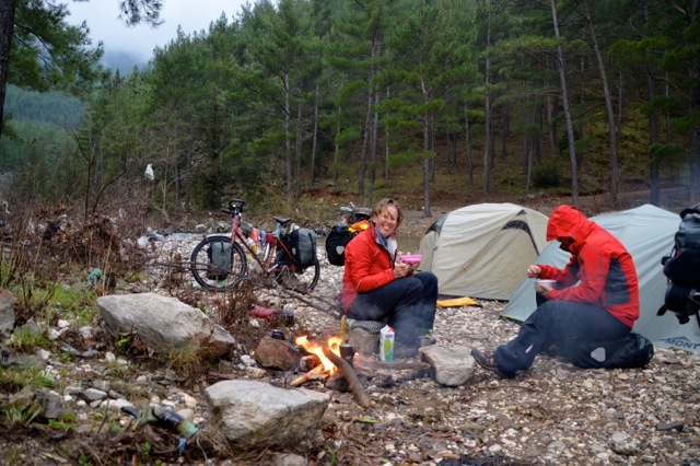 Making dinner at this perfect campsite by the river.